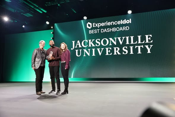 Accepting the Ellucian Experience Idol Best Dashboard award on stage